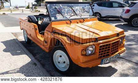 Bordeaux , Aquitaine France - 07 25 2021 : Citroen Mehari Ancient Beach Car Orange Convertible Vehic