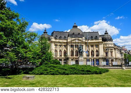 Bucharest, Romania, 6 May 2021: The Central University Library With Equestrian Monument To King Caro