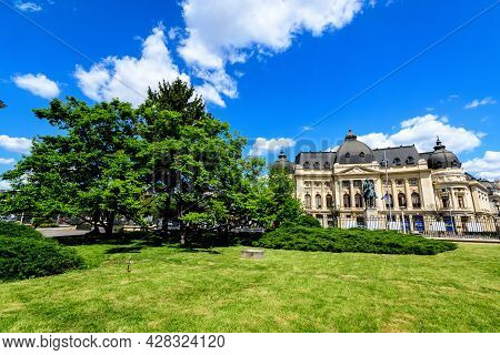 Bucharest, Romania, 6 May 2021: The Central University Library With Equestrian Monument To King Caro
