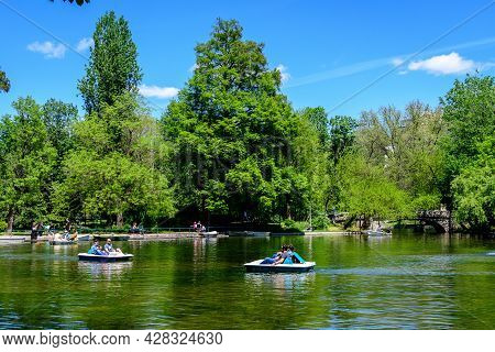 Bucharest, Romania - 9 May 2021: Vivid Green Landscape With Old Large Linden Trees And Green Leaves 
