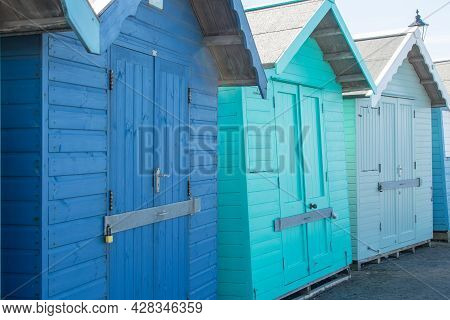 Beach Huts Or Bathing Boxes. Blue Wooden Vacation Cabins On The East Coast Uk. Pretty Seaside Holida