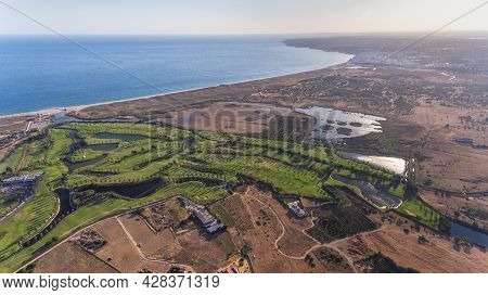 Green Golf Courses By The Sea. Salgados Beach. Portugal, Albufeira. Aerial View.