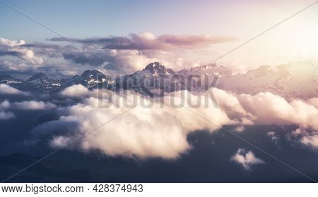 Aerial View From Airplane Of Canadian Mountain Landscape, Tantalus Range. Sunny Sunset Art Render. T