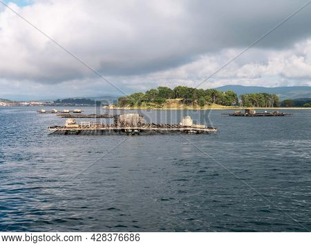 O Grove, Spain - July 24, 2021:
Mussels, Oysters And Scallops Farm Platform In The Arousa Estuary Ne