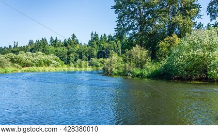 A Landscape Shot Of The Sammamish River In Washiington State.