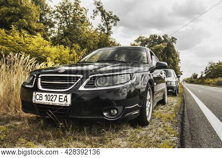 Chernigov, Ukraine - July 24, 2021: Saab Cars On The Road. Black Car Saab 9-5 Sportcombi