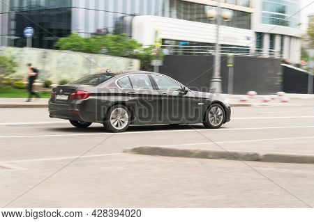 Moscow, Russia - May 2021: Dark Gray Color Bmw 5 Series F10 In Fast Motion On The Street