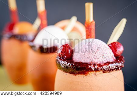 Exquisite Cantaritos With Tequila And Mango, Strawberry And Lime Snow, Accompanied By Mexican Candie