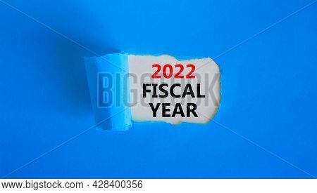 2022 Fiscal New Year Symbol. Words '2022 Fiscal Year' Appearing Behind Torn Blue Paper. Beautiful Bl