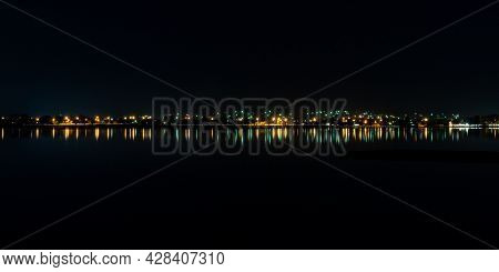 Nighttime Street Lights Reflecting Blurry Streaks Along The Waterfront Of Lake Wendouree In Ballarat