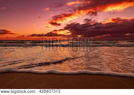 A Beach View Beautiful Sunset Overlooking The Dramatic Clouds And Sea From Ground Level