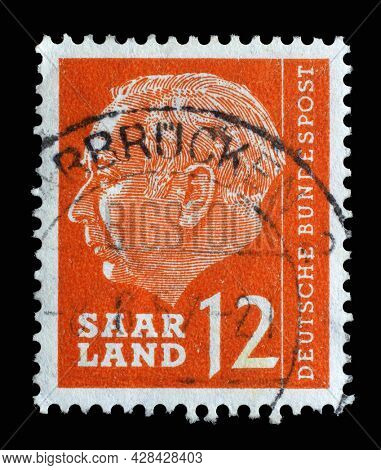 ZAGREB, CROATIA - SEPTEMBER 05, 2014: Stamp from Germany area Saar shows portrait of Theodor Heuss (1884-1963), first President of the Federal Republic of Germany, circa 1957