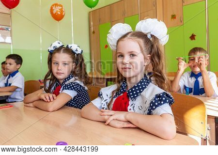 Krasnodar, Russia - September 1, 2020: First-form Schoolchildren In Classroom At School Desks On Hol