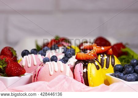 Macaroon, Handmade Beautiful Sweet Food, Dessert With Fresh Strawberries And Blueberries Decorated W