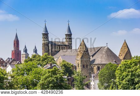 Towers Of Historic Churches In The Skyline Of Maastricht, Netherlands