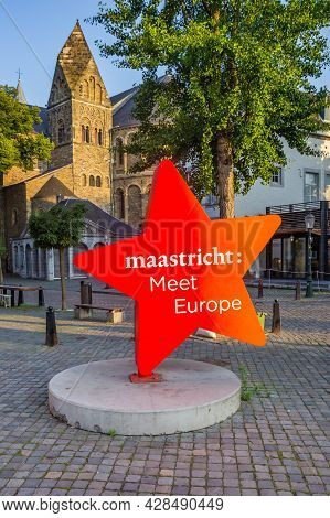 Red Star Icon With Text In Front Of The Church Tower In Maastricht, Netherlands