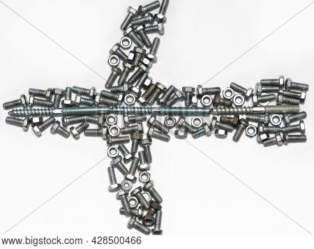 Abstract Figure Of An Airplane Made Of Hardware. The Plane Is Made Up Of New And Old Rusty Bolts And