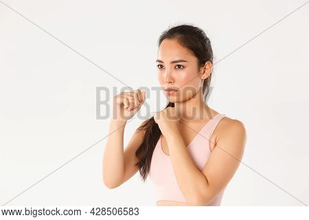 Sport, Wellbeing And Active Lifestyle Concept. Close-up Side View Of Serious Asian Girl In Fitness C