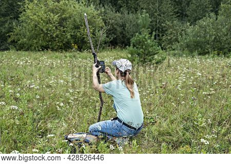 Young Woman Scientist Biologist Zoologist Sets Camera Trap For Observing Wild Animals In Summer Taig