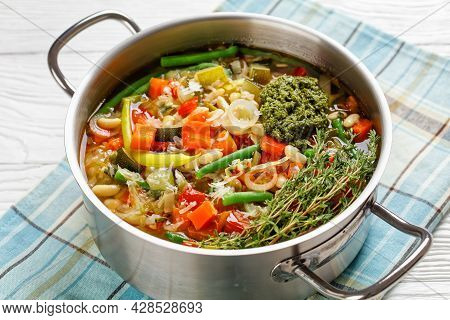 Vegetarian Summer Soupe Au Pistou, French Vegetable Bean Soup With Sauce Pesto And Herbs In A Metal 