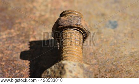 Old Rusty Bolt, Iron Rod With Screw Threads. Rusted Mechanical Components. Threaded Bolt And Nut Iso