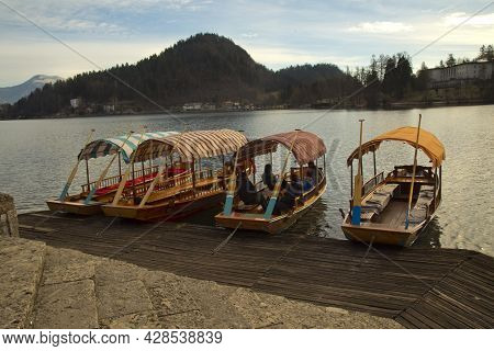 Slovenia, 30 December 2018. Traditional Pletna Boats On Lake Bled (blejsko Jezero).