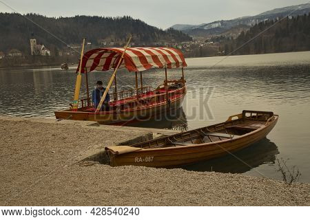 Slovenia, 30 December 2018. Traditional Pletna Boats On Lake Bled (blejsko Jezero).