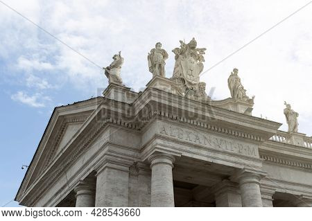 Details Of The Entablature With Statues Of Religious Saints On The Colonnades Of St. Peter's Basilic