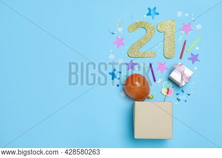 Flat Lay Composition With Decor And Numbers On Light Blue Background, Space For Text. 21th Birthday 