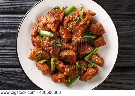 Tibs Is An Ethiopian Dish Consisting Of Stir-fried Meat And Vegetables Closeup In The Plate On The T