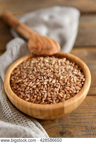 Wholegrain Uncooked Raw Spelt Farro In Bowl On The Wooden Background
