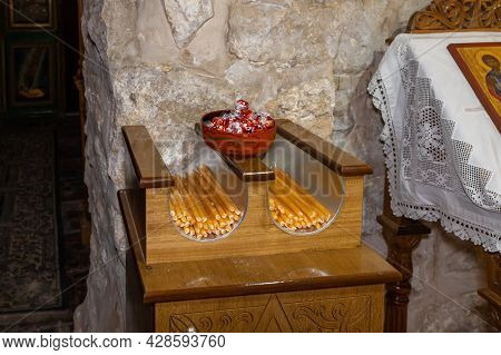Jerusalem, Israel, July 17, 2021 : Stand With Candles On The Table In The Interior Of The Small Feod
