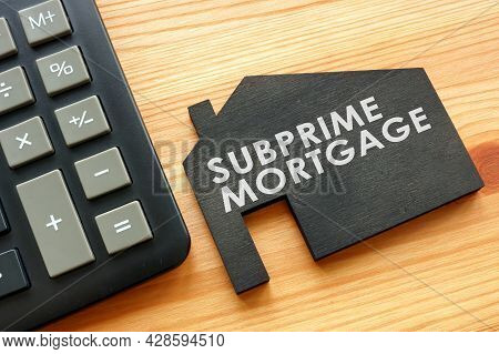 Subprime Mortgage On The Model Of Home And Calculator.