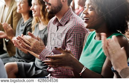 Diverse audiences giving an applause