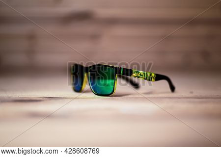 Vintage Polarising Green Sunglasses On Wooden Background