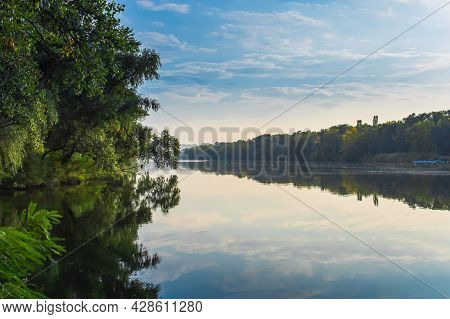 Landscape Forest Trees In The Mirror Reflection Of Water