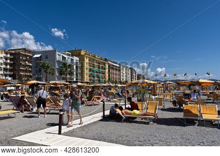 Ceriale, Ligurian Sea, Italy - 12 July 2021: Tourists Flock To Italian Beaches. The Bathing Establis
