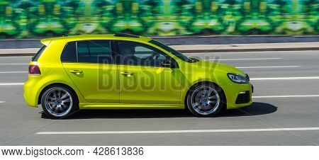 Volkswagen Golf Mk7 Is Seventh Generation Of The Famous German Hatchback. Side View Of Lime Yellow C