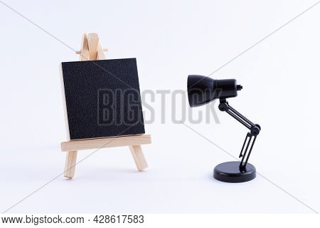 Wooden Easel Miniature With Blank Black Square Canvas For Artists And Painters - Mockup. Mini Wooden