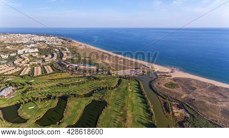Green Golf Courses By The Sea. Salgados Beach. Portugal, Albufeira. Aerial View.
