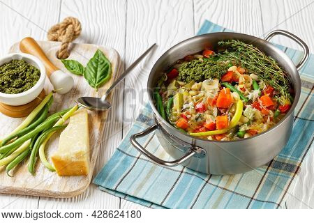 Vegetarian Summer Soupe Au Pistou, French Vegetable Bean Soup With Sauce Pesto And Herbs In A Metal 