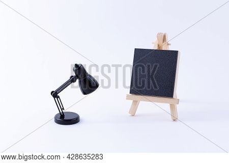 Wooden Easel Miniature With Blank Black Square Canvas For Artists And Painters - Mockup. Mini Wooden