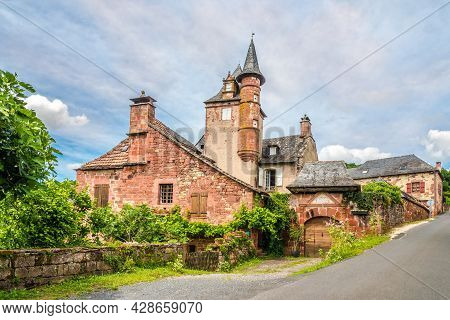 In The Streets Of Collonges La Rouge In France.