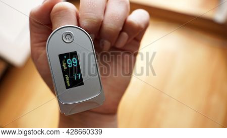 Pulse Oximeter On Finger Showing Oxygen Saturation And Heart Rate. Prevention Of Hypoxia In Pneumoni