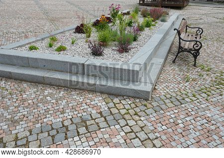 Delivery Of Gray River Pebbles Like Mulch To Flower Beds In The Garden Using A Wheelbarow From The B