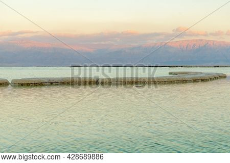 Sunset View Of Salt Formations In The Dead Sea, With The Edom Mountains In The Background. Southern 