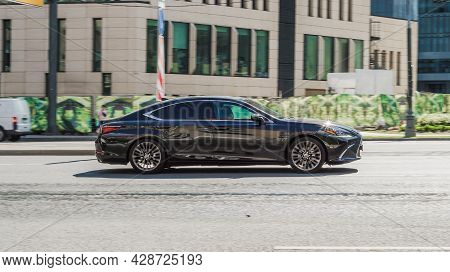 Black Lexus Es 350 In Motion. Lexus Seventh Generation Xz10 Driving At High Speed With Blurred Backg