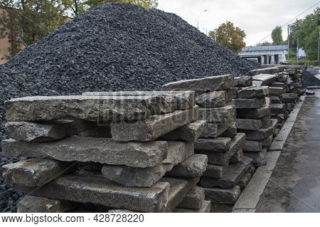 Neatly Stacked, Stacked On Top Of Each Other, Old Rectangular Cement-gray Road Curbs, Lyied In Conne