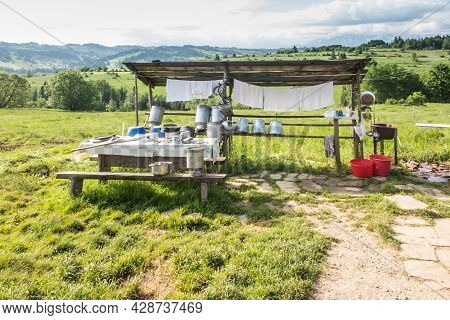 Shepherd's Hut In Banska Wyzna In Podhale, Poland. Around, Various Equipment Needed To Secure The Gr