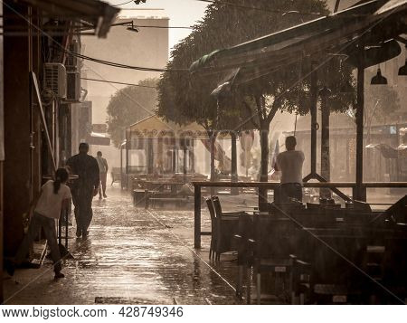 Smederevska Palanka, Serbia - July 18, 2021: Selective Blur On People Running To Find Shelter To Avo